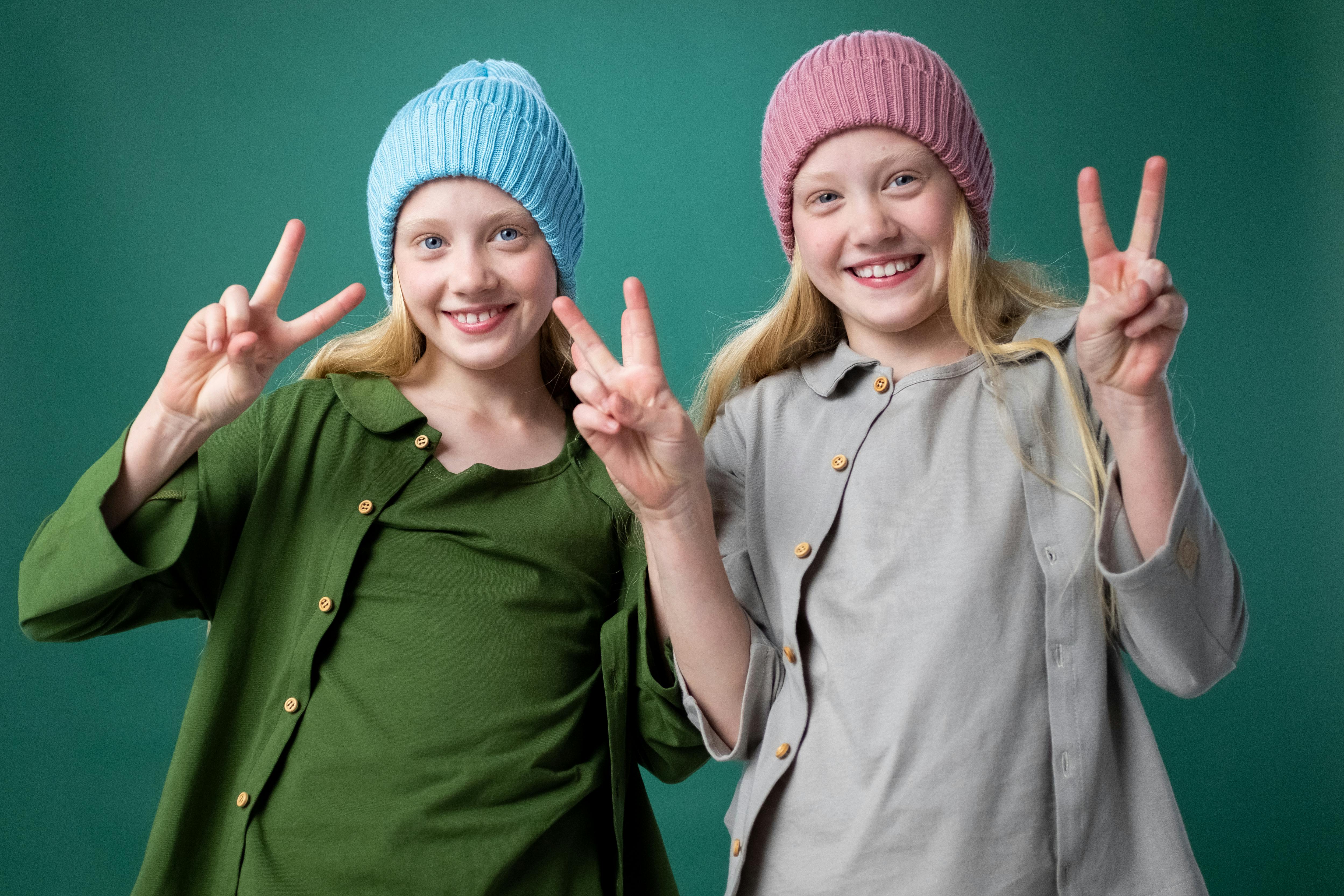 2 women smiling and standing