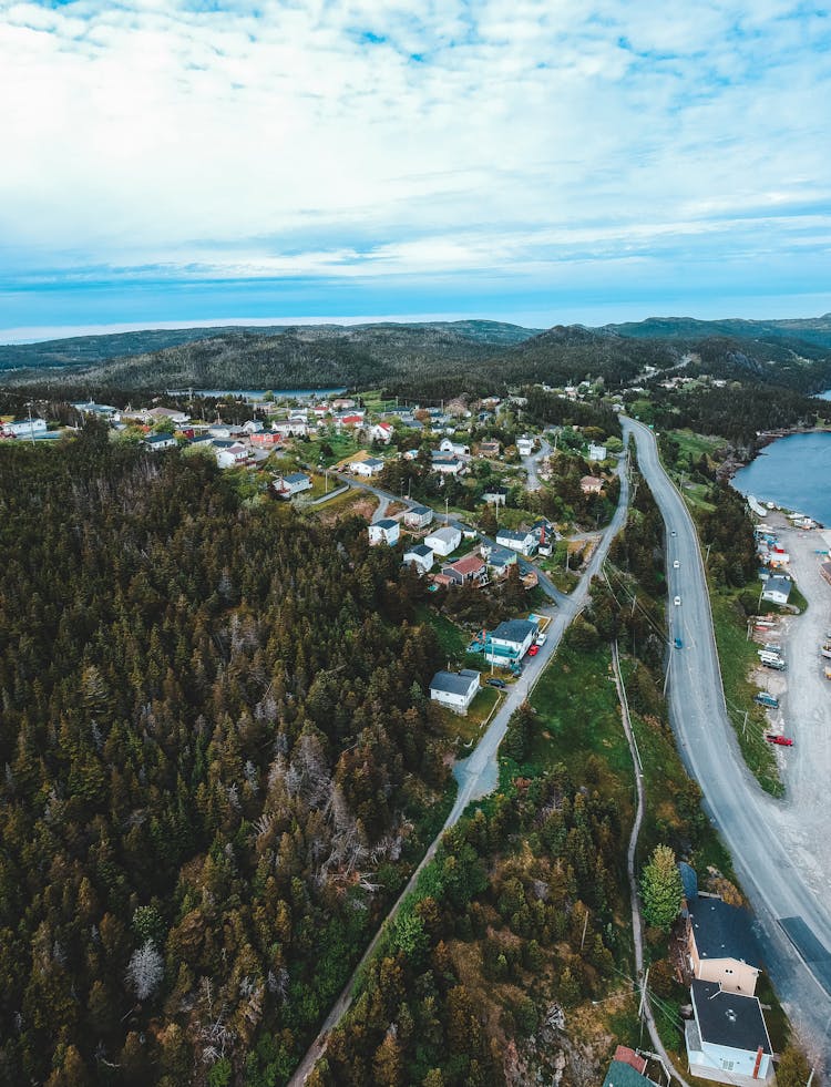 Wavy Road Between Mountains With Forest And Sea