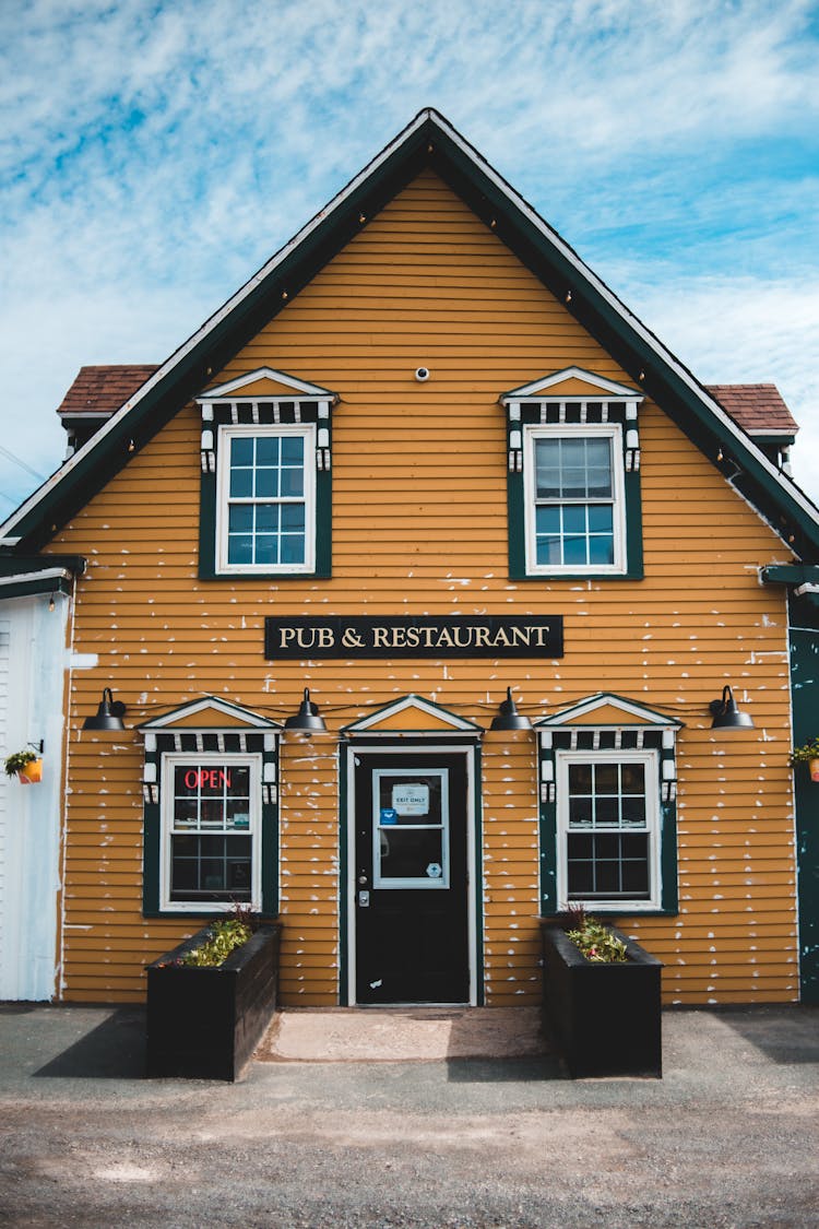 Old Wooden Pub Facade Near Road In City