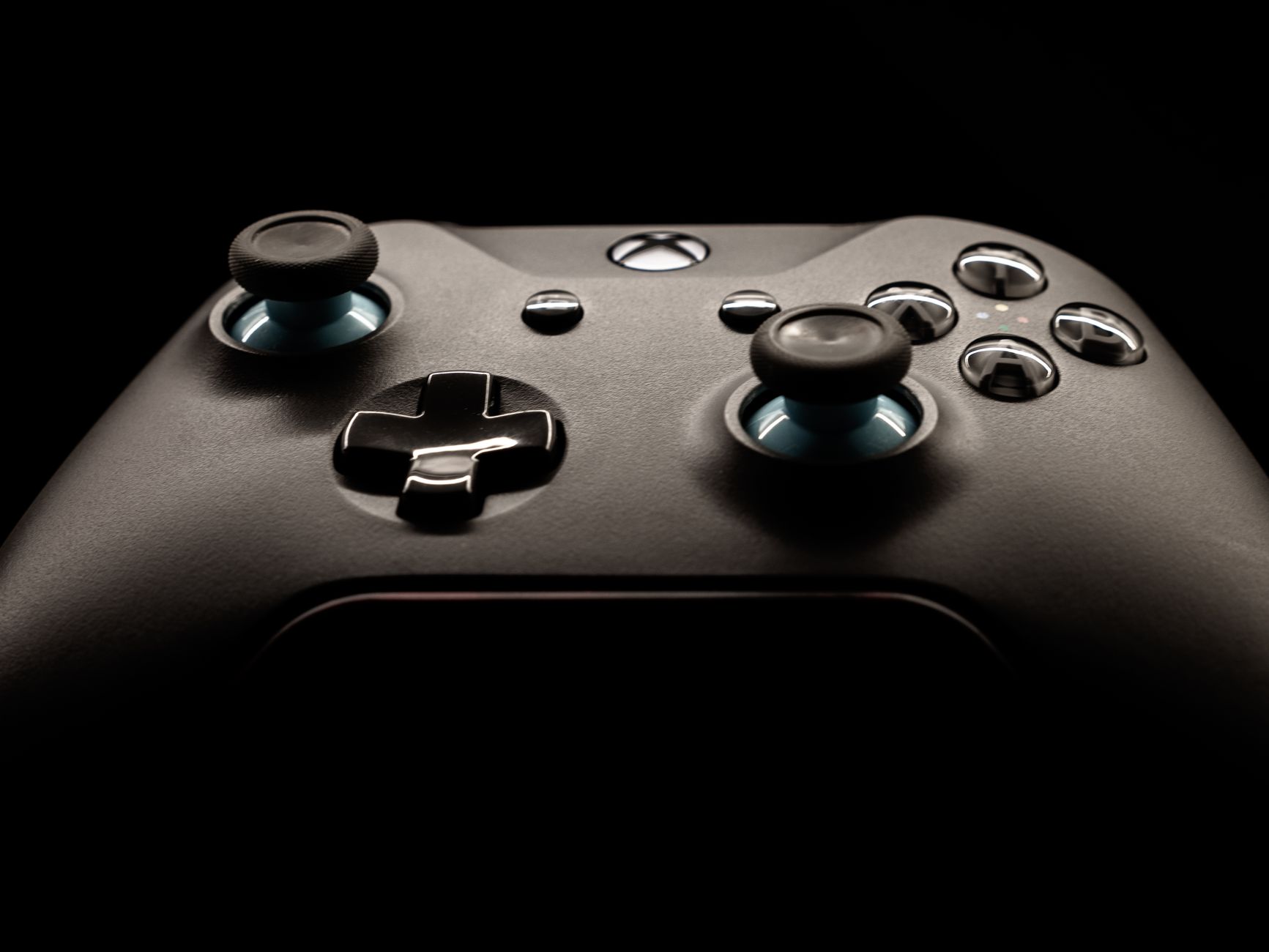 A detailed close-up of a modern gaming controller highlighting its design and functionality.