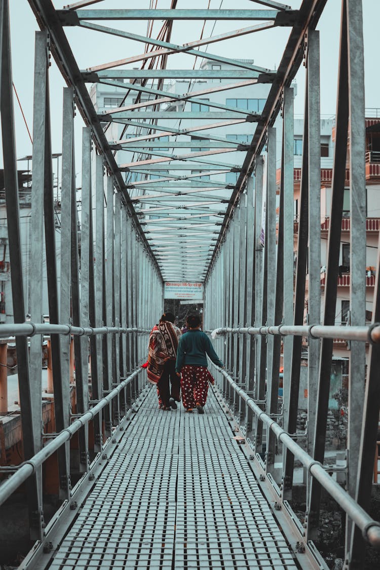 People Walking On The Bridge