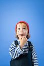 Girl in White and Black Striped Long Sleeve Shirt and Red Knit Cap