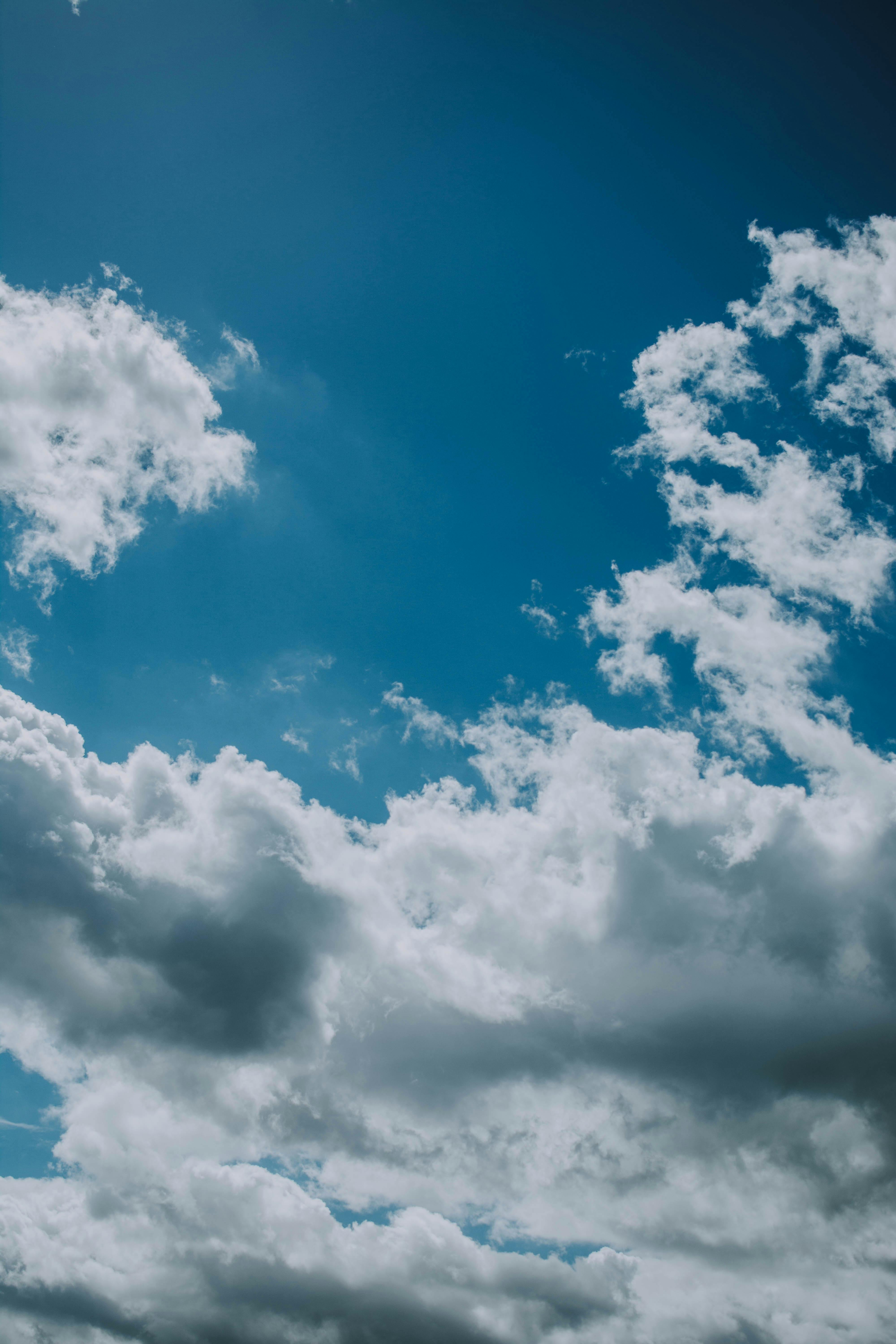 Blue sunny bright sky with clouds ?? Free Stock Photo
