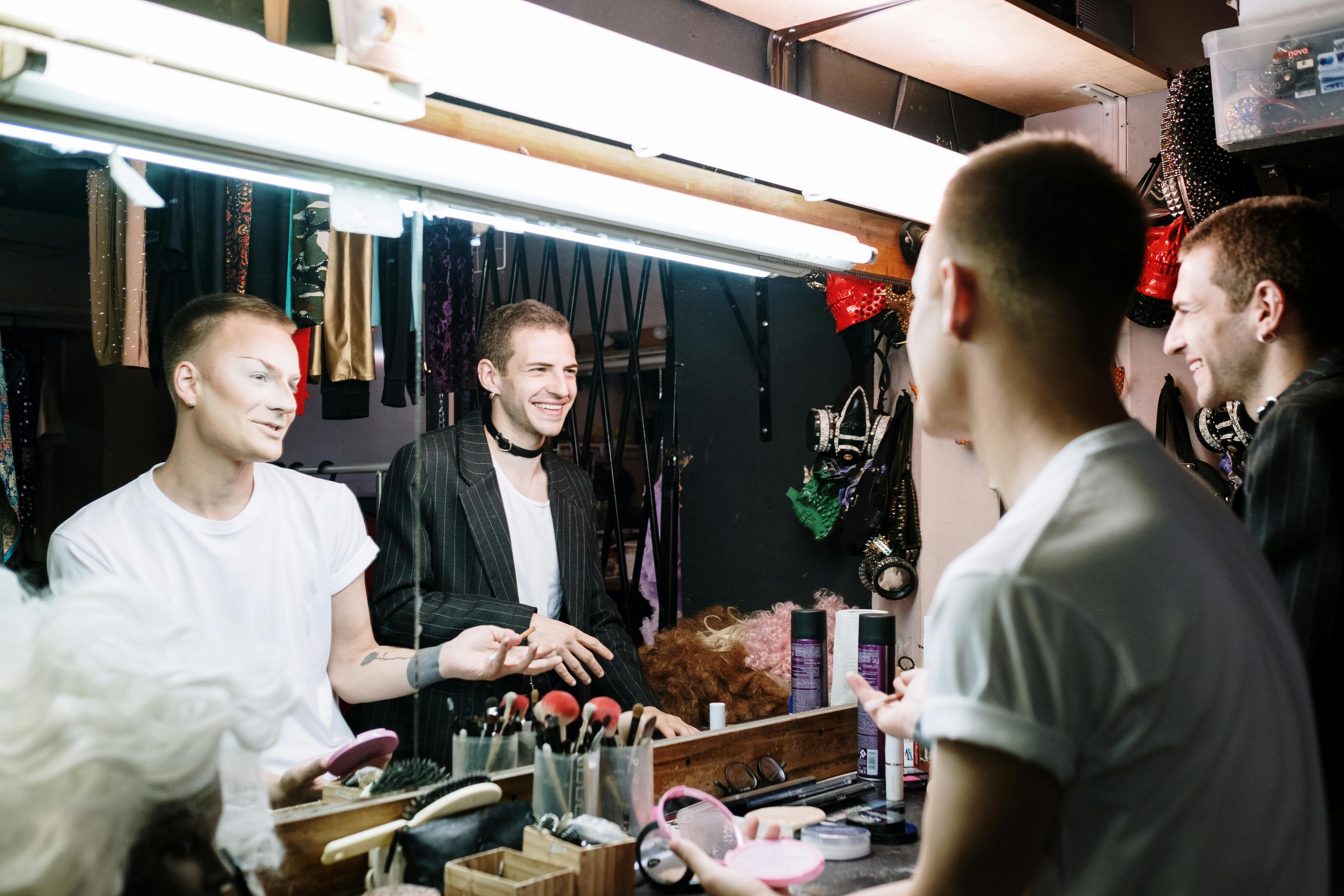 drag queens chatting in dressing room