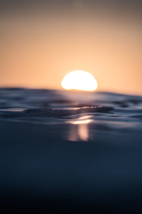 Free Sea water on background of setting sun Stock Photo