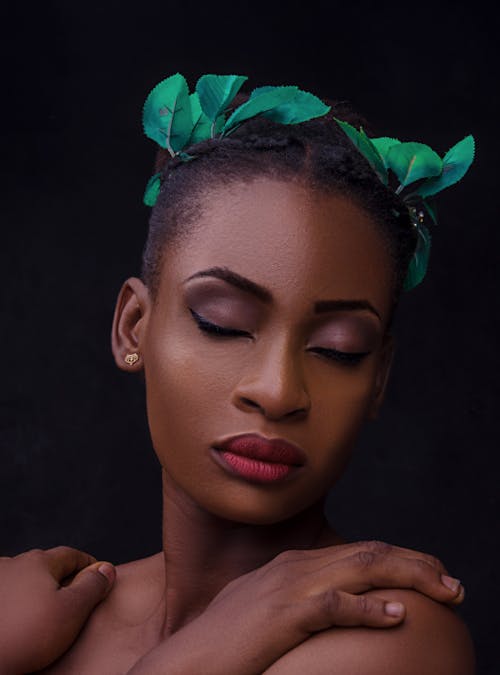 Woman with Green Leaves on the Hair