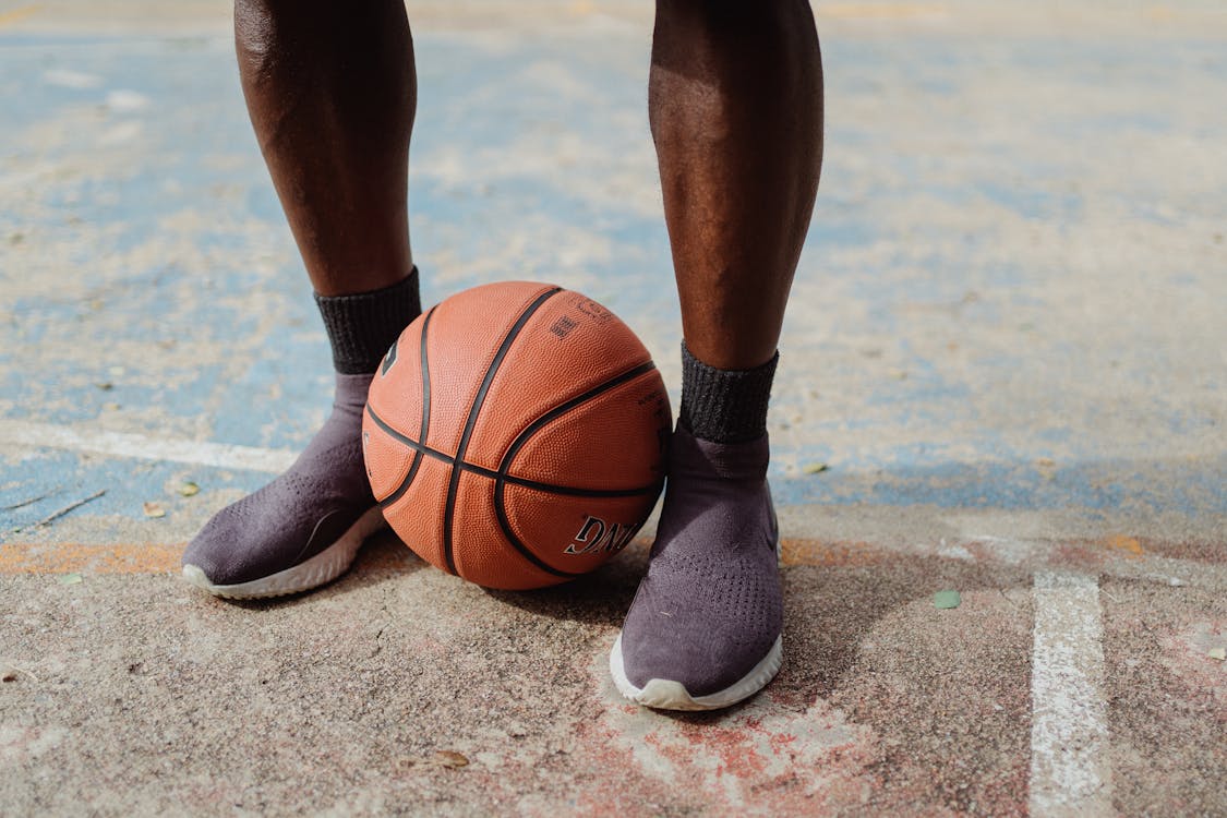 Free Person Standing Near Basketball Stock Photo