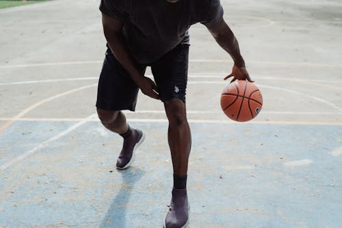 Man Playing Basketball