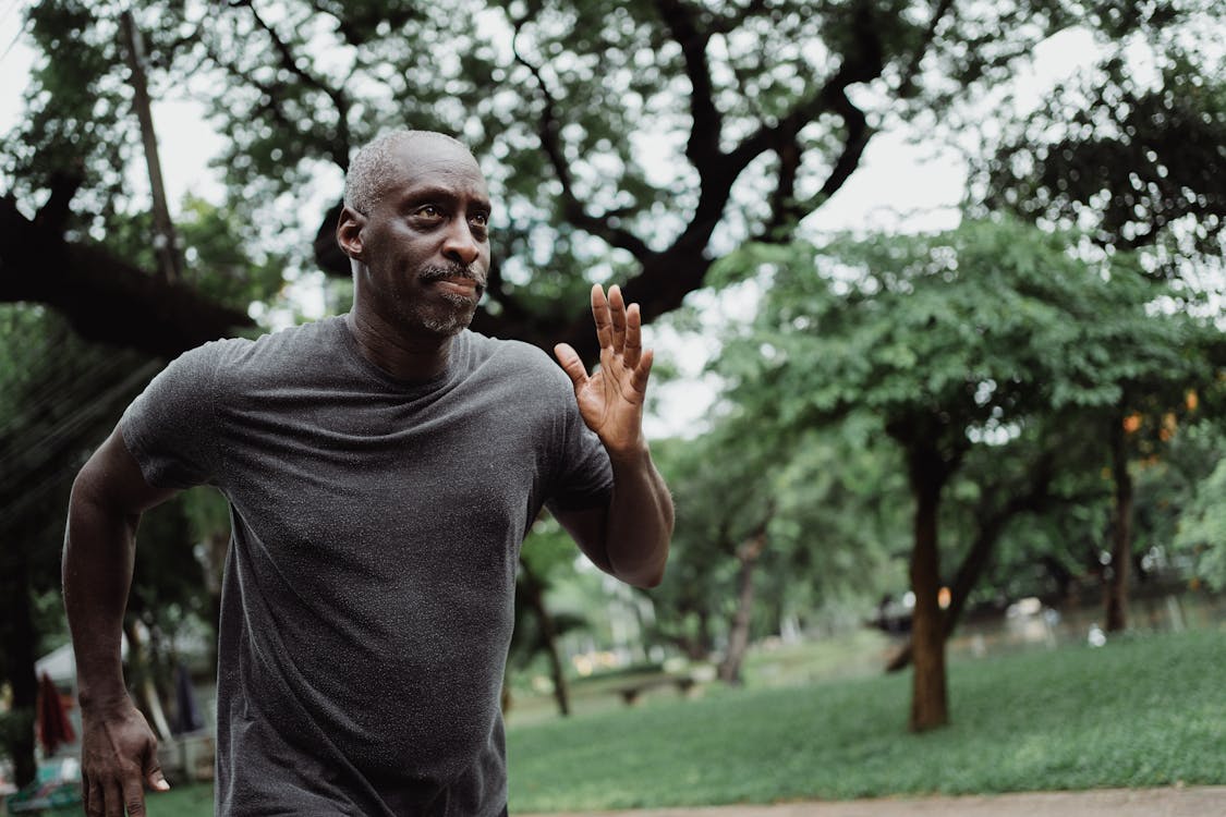 Shallow Focus Photo of Man in Gray Shirt