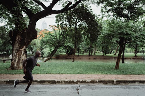 Man in Gray Crew Neck T-shirt Running