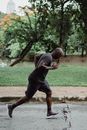 Man in Gray Crew Neck T-shirt Running