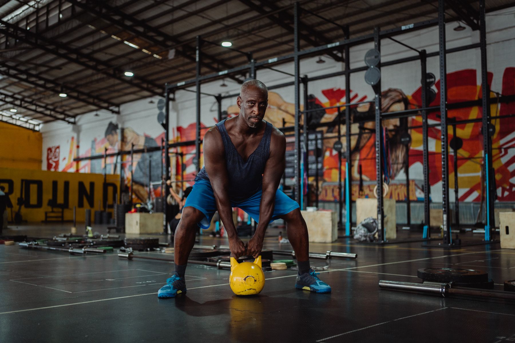 Athlete performing kettlebell training in a functional fitness gym