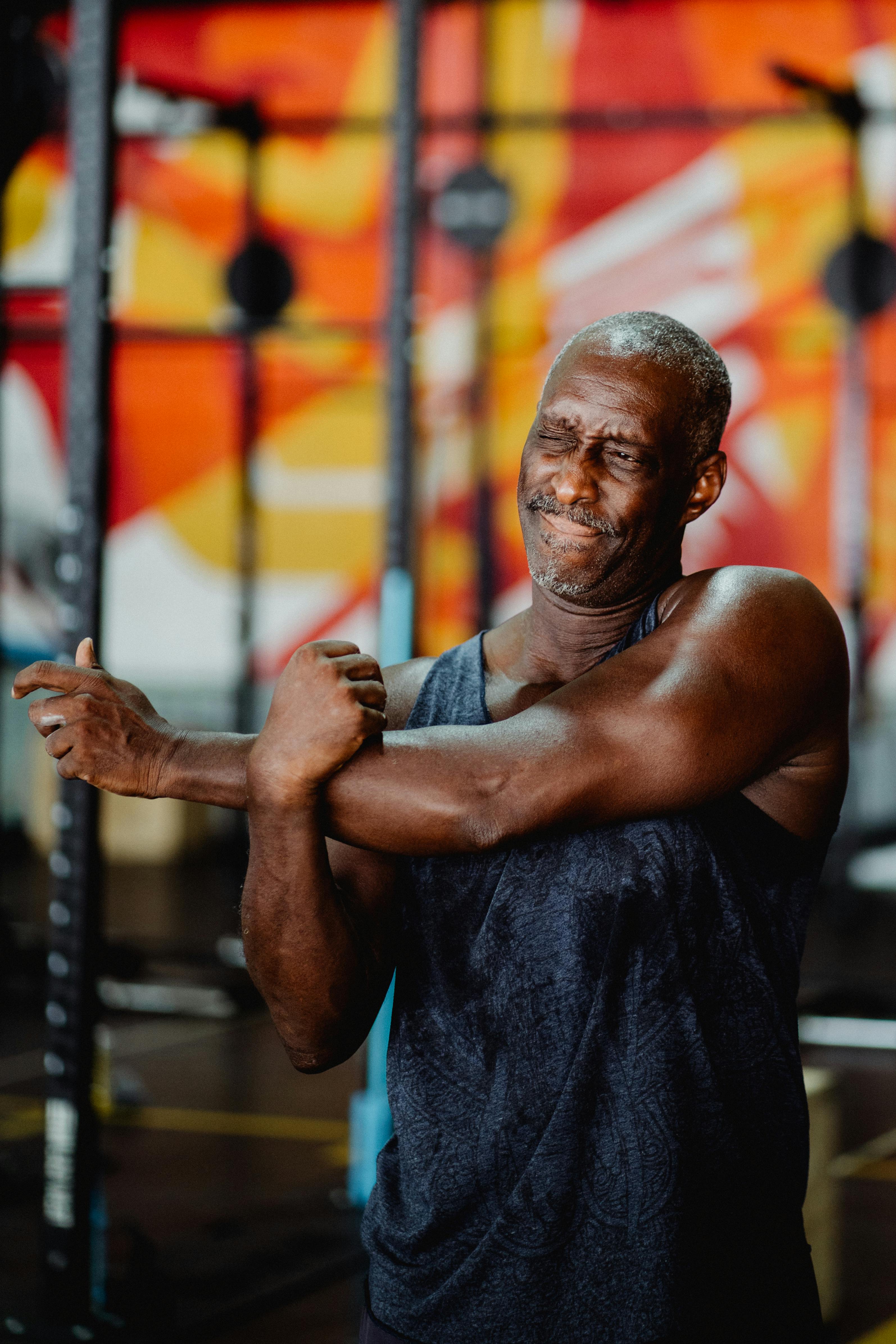 shallow focus photo of man stretching