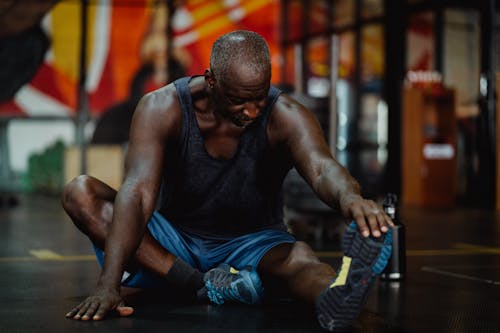 Shallow Focus Photo of Man Stretching