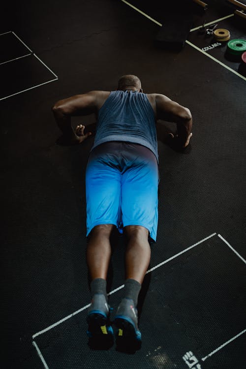 Man in Blue Shorts Doing Push-Ups