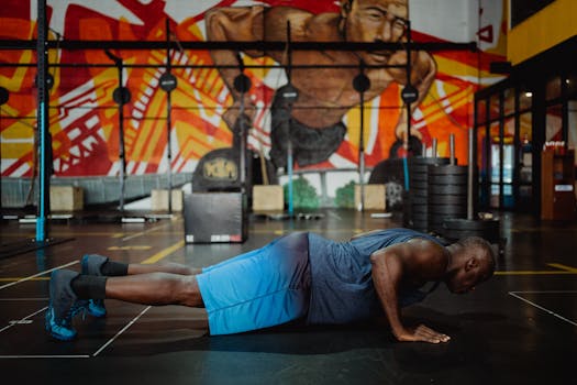 Black man performing push-ups in a colorful urban gym setting, focusing on strength and fitness.