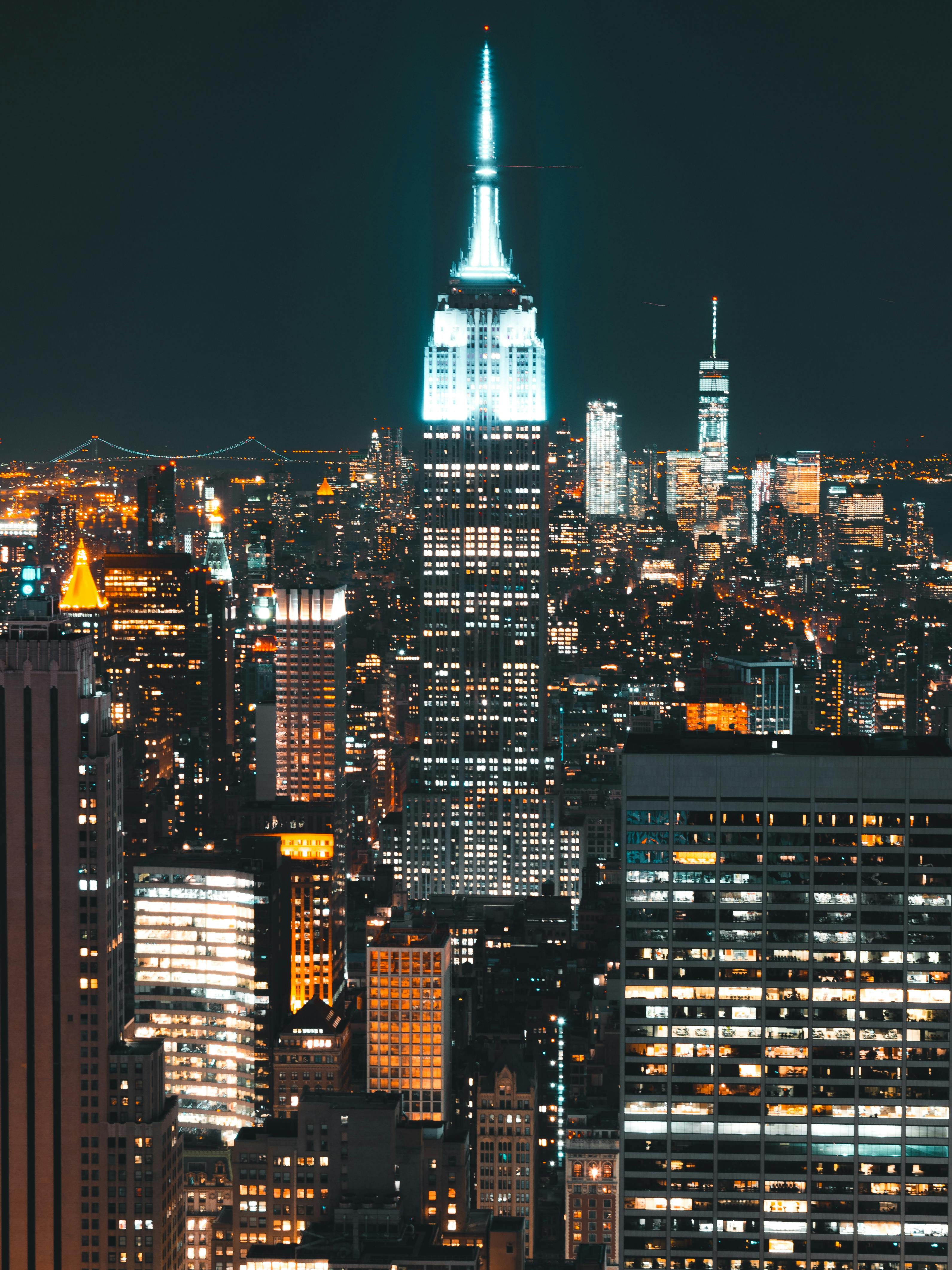 Download Lively Night In New York Skyline iPhone Wallpaper  Wallpaperscom