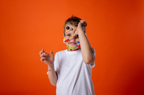 Girl in White Crew Neck T-shirt With Blue and White Face Paint