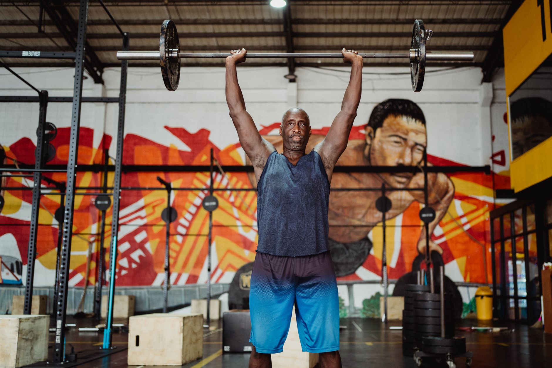 Man doing resistance training with dumbbells