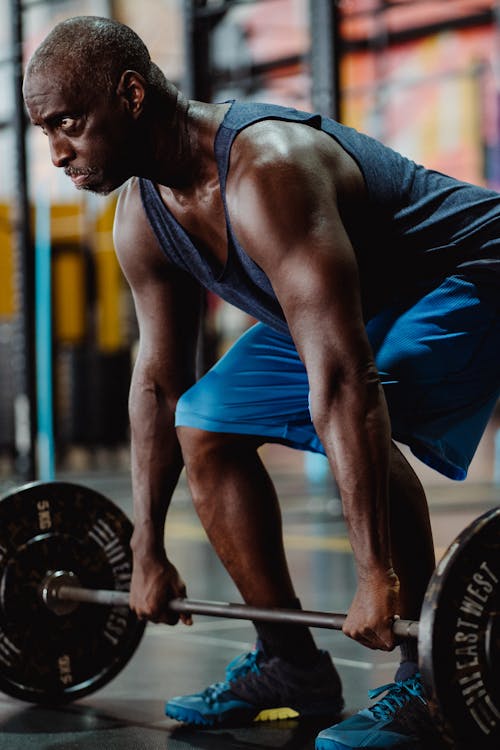 Free Determined Man Lifting a Barbell  Stock Photo