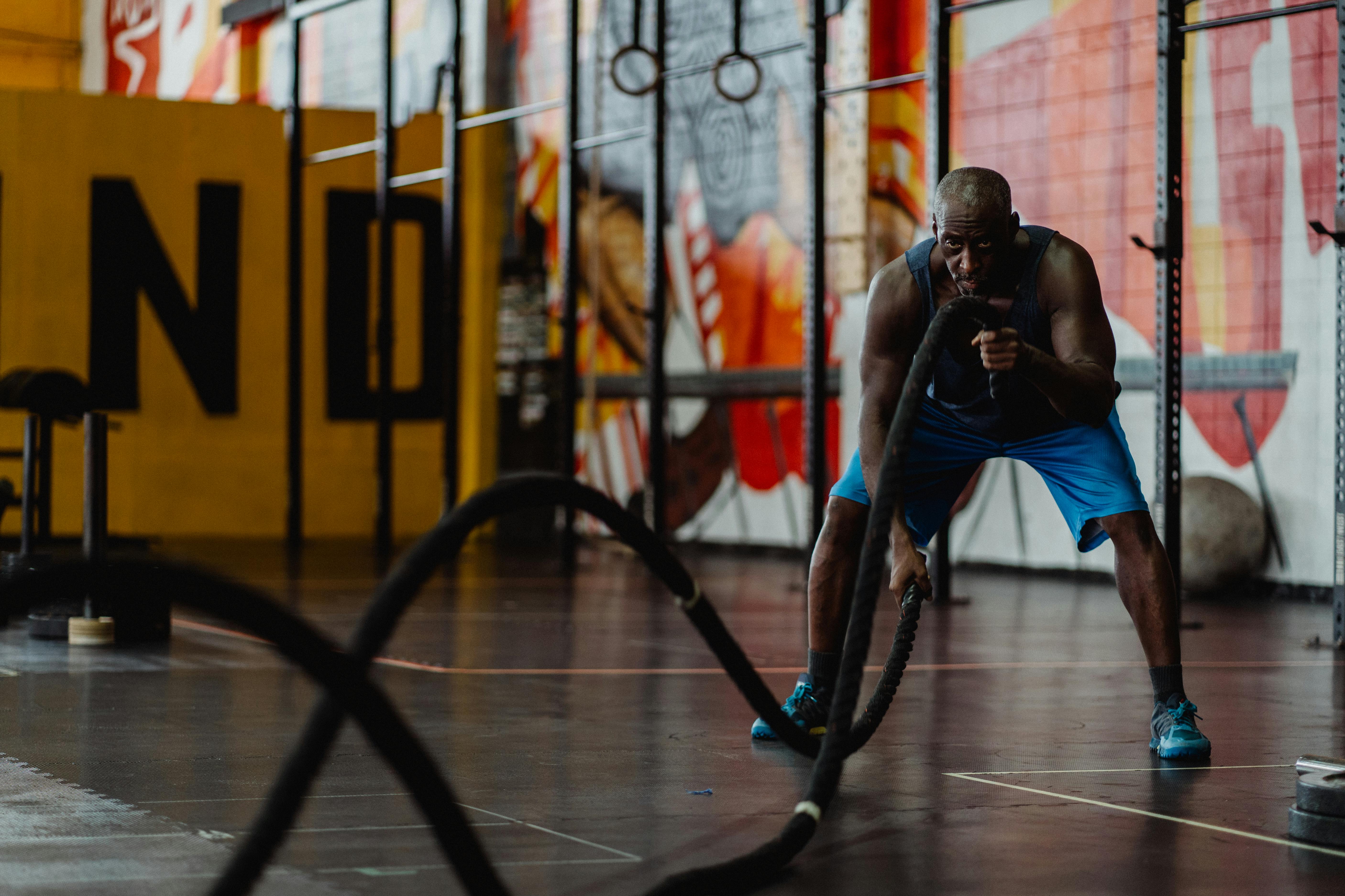 Man in Blue Shorts Doing Battle Ropes Exercise