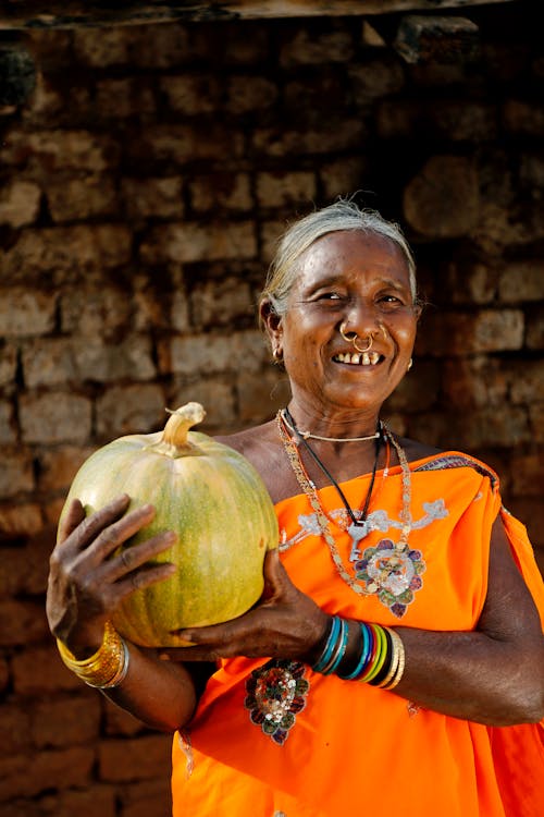 Free Smiling Elderly Woman Holding a Watermelon  Stock Photo