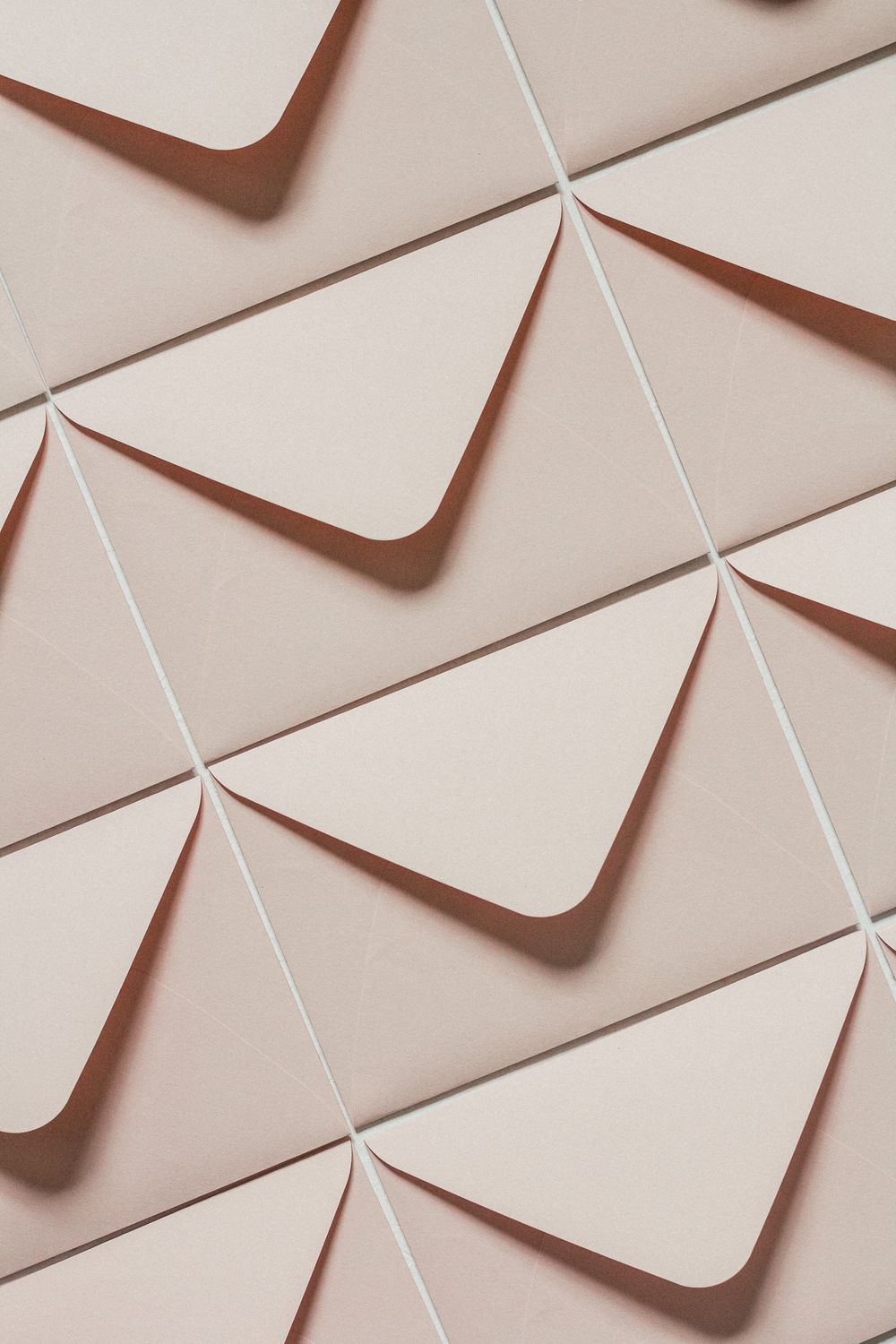 Envelope Positioning Beige Envelopes on Symmetrical Positioning · Free Stock Photo