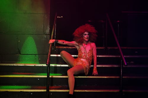 Drag Queen Sitting on Stairs