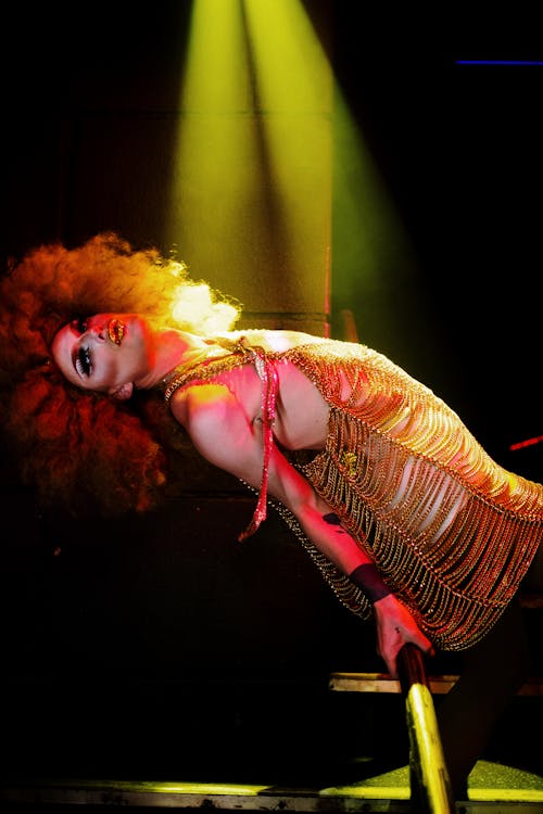 Drag Queen Holding a Hand Rail and Posing