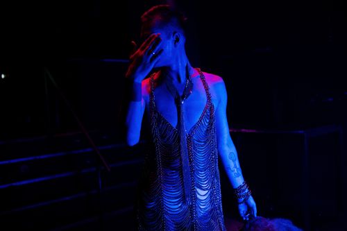 Free Capturing the vibrant transformation and glamour of a drag queen during a nightclub performance. Stock Photo