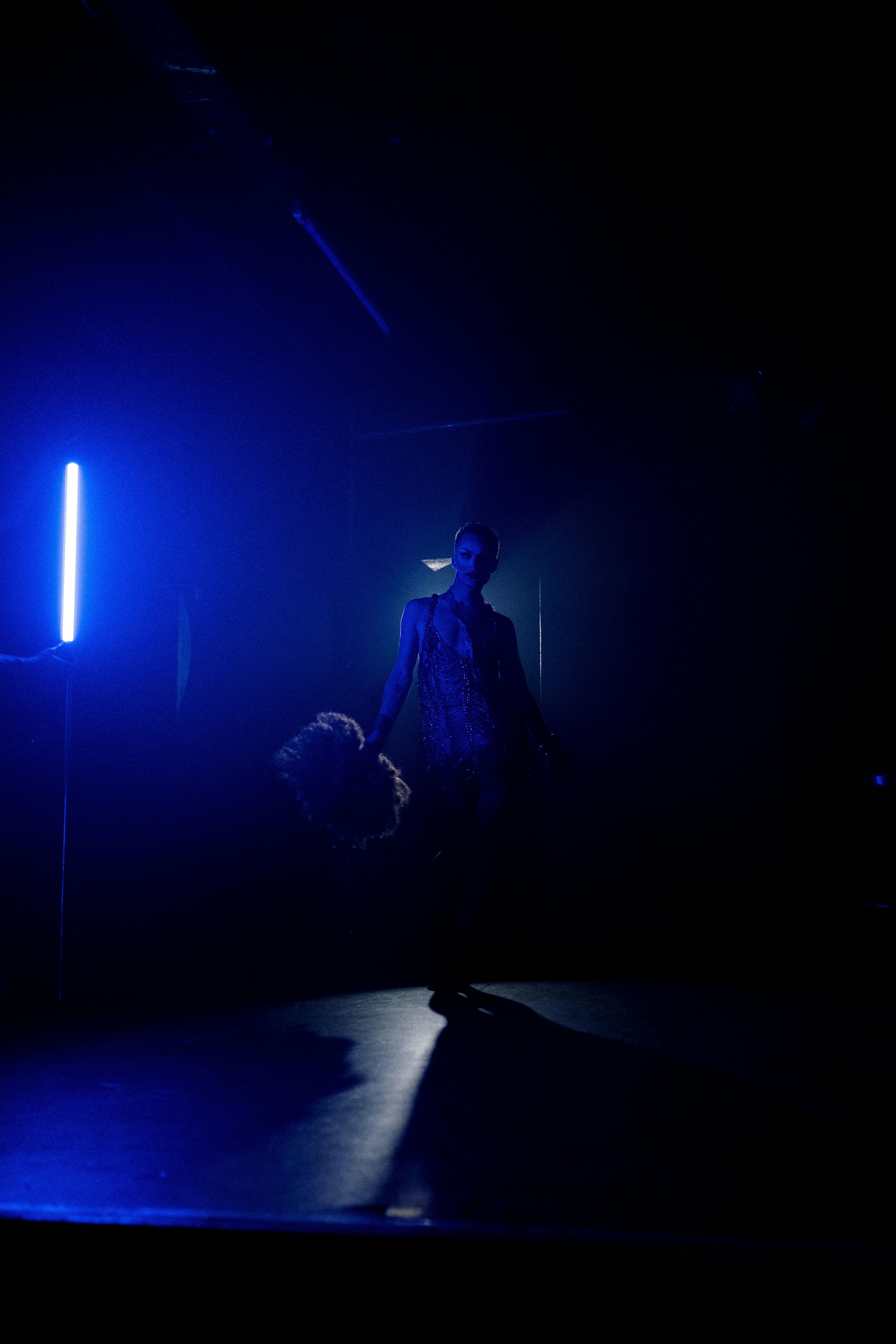 silhouette of man standing on stage