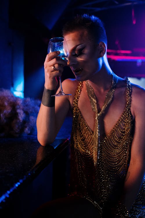 Drag Queen Holding a Wine Glass