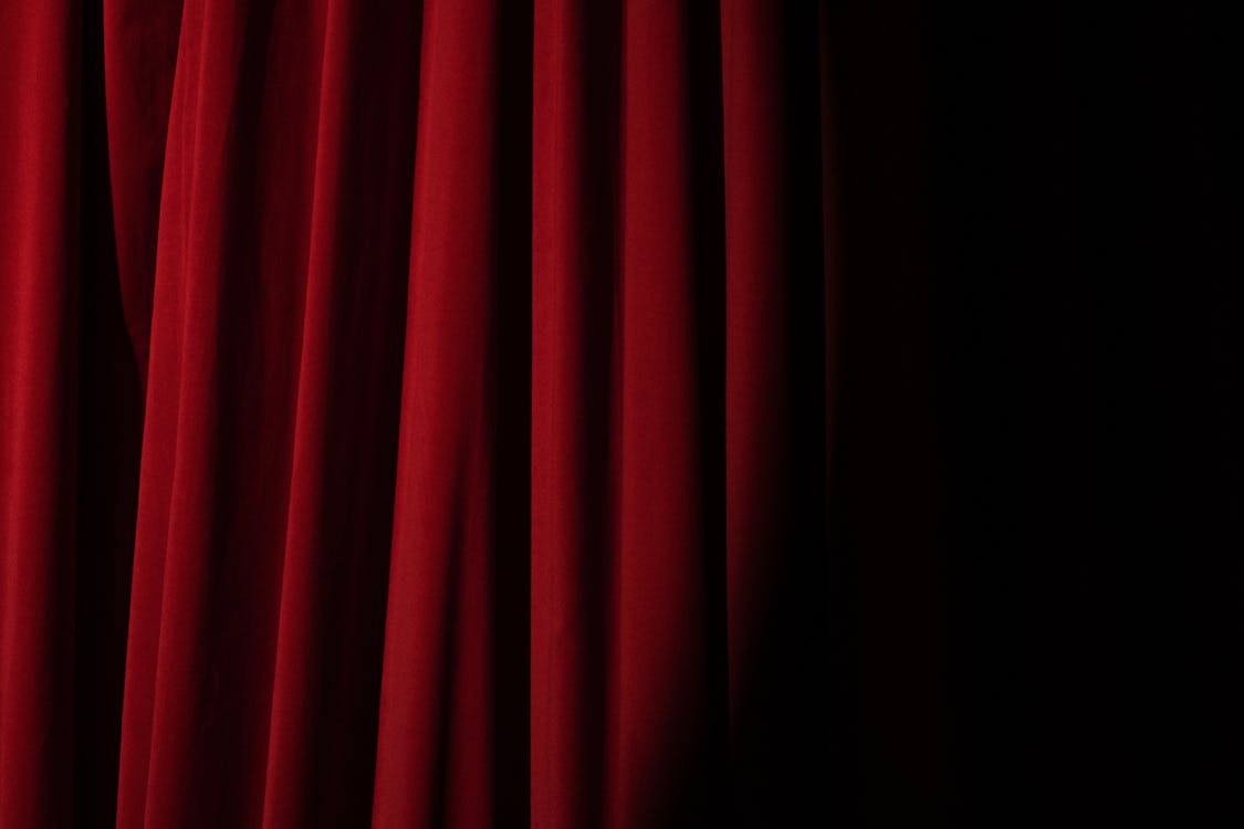 Spotlight on a Red Curtain