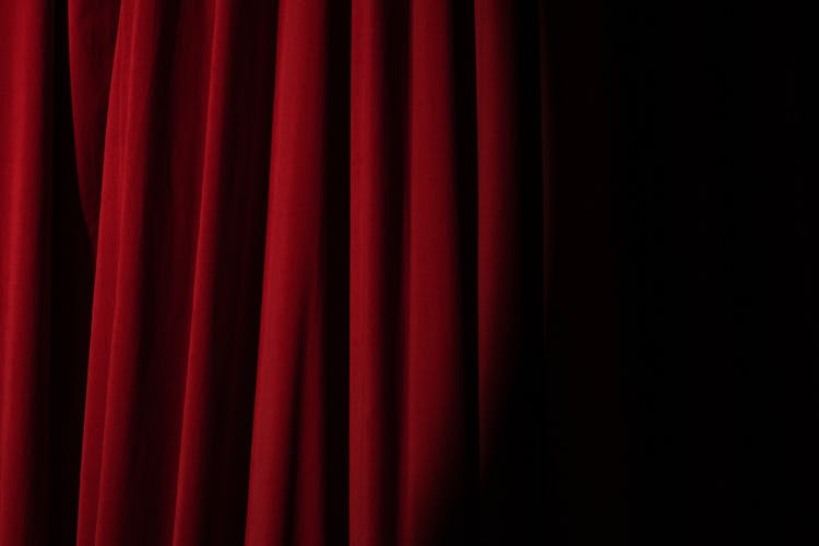 Spotlight On A Red Curtain