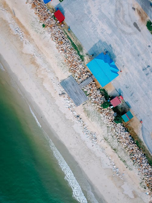 Tropical sandy beach with colorful houses