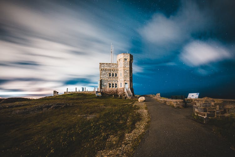 Old Building With Tower Near Pathway Under Night Sky