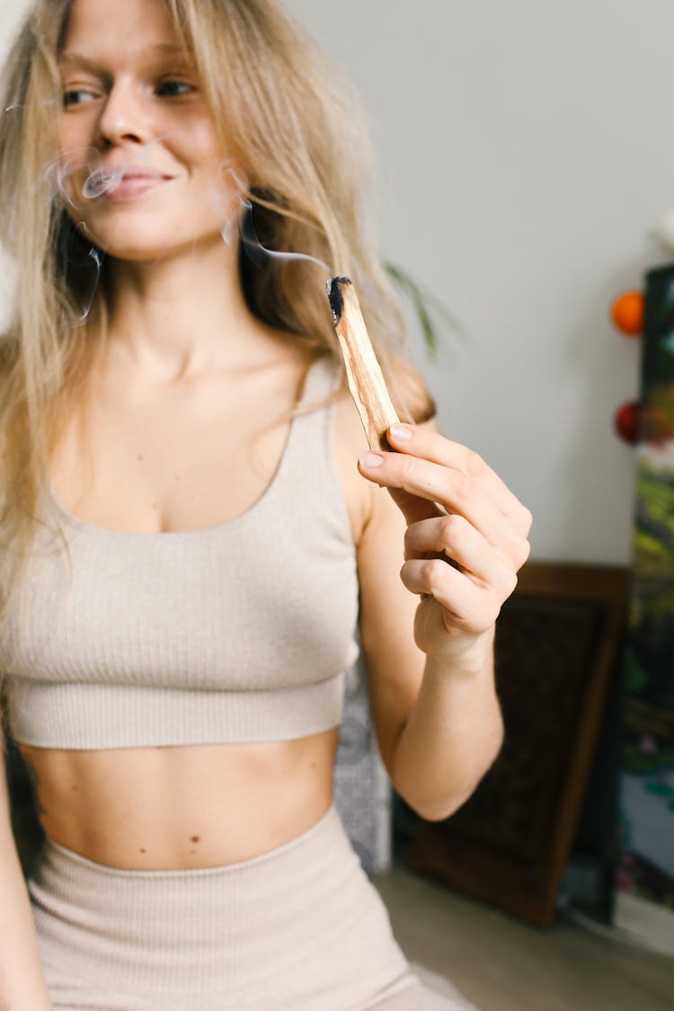 Woman Holding A Burning Sage