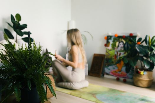 Woman Sitting in Front of an Altar Doing a Ritual