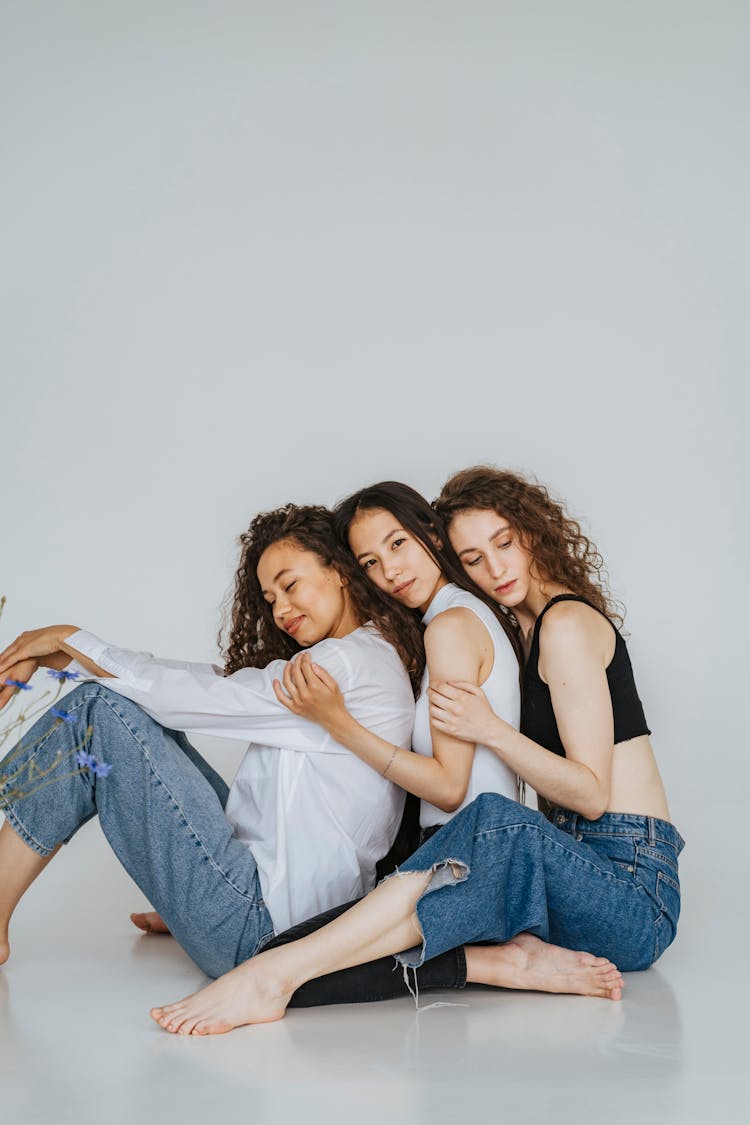 Photo Of Women Sitting On The Floor