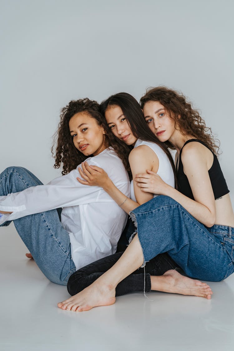 Three Women Sitting On The Floor