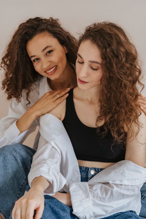 Free Two women enjoying each other's company with smiles, creating a warm and joyful atmosphere. Stock Photo