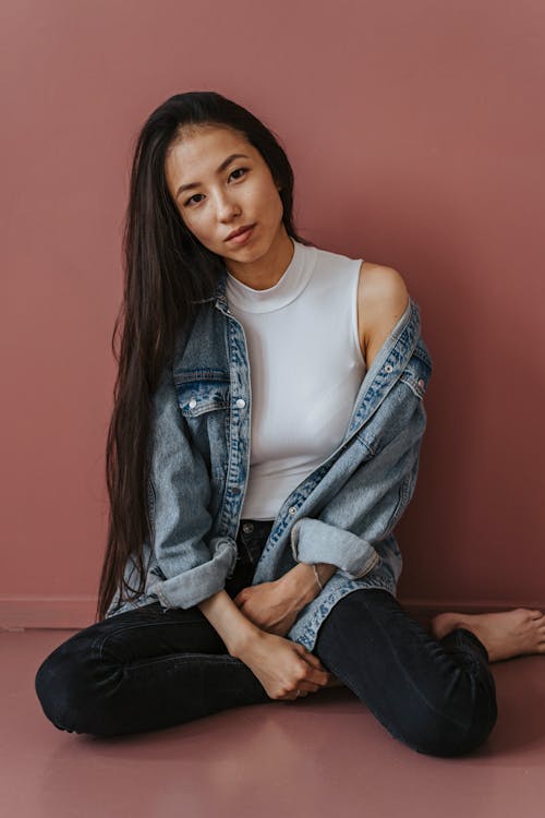 Woman in Blue Denim Jacket and White Tank Top