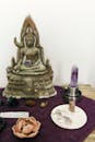 Gold Buddha Figurine on Purple Textile