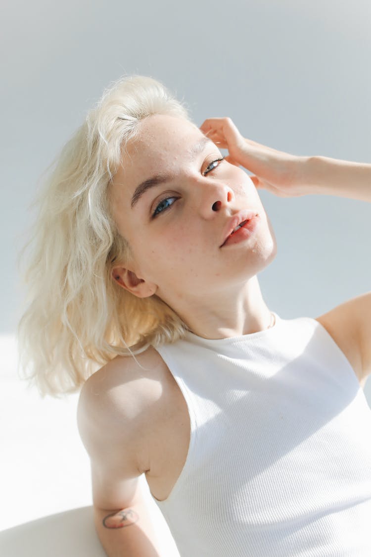 Blonde Woman Touching Her Hair 