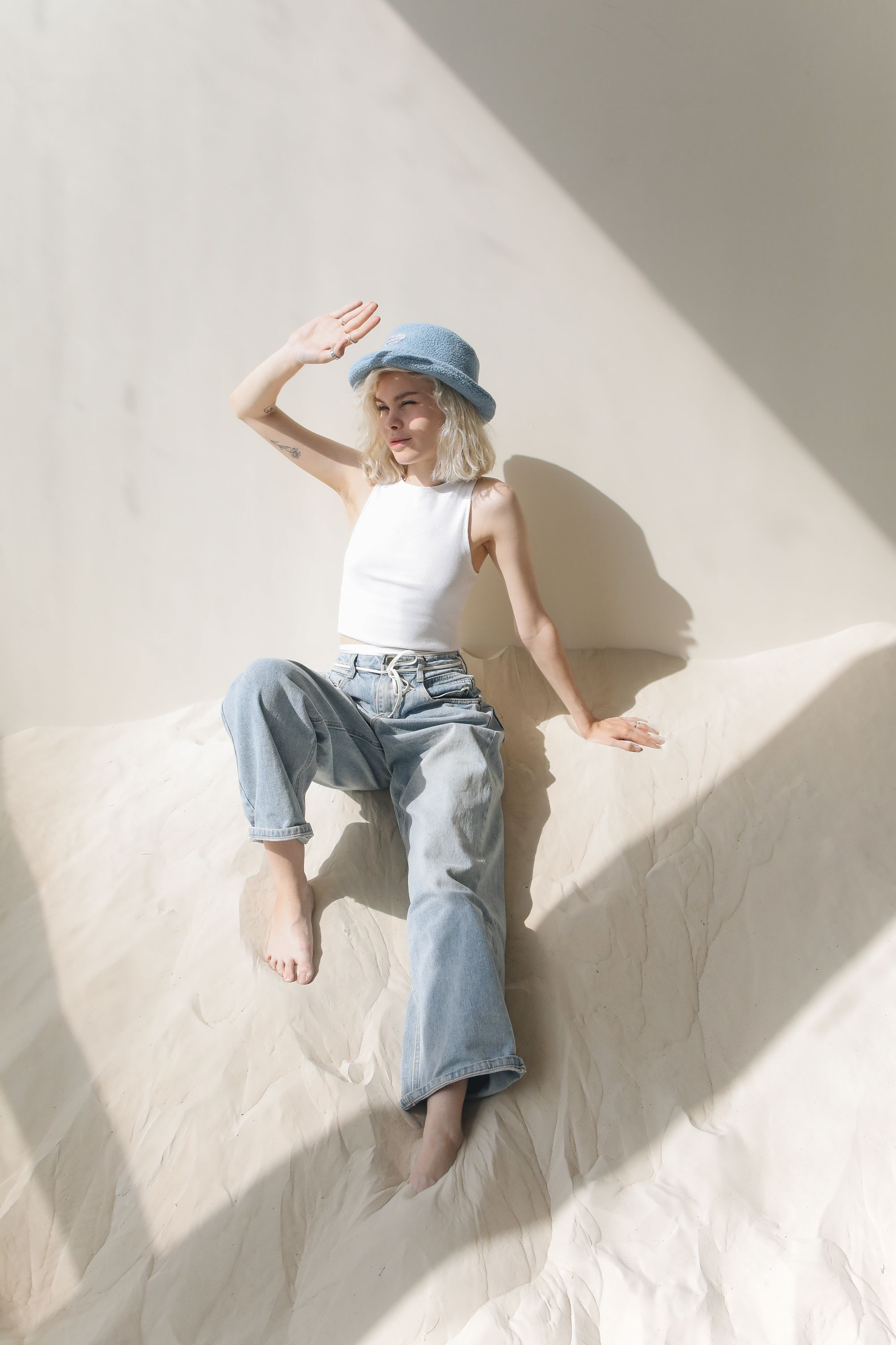Woman in White Top and Blue Denim Jeans · Free Stock Photo