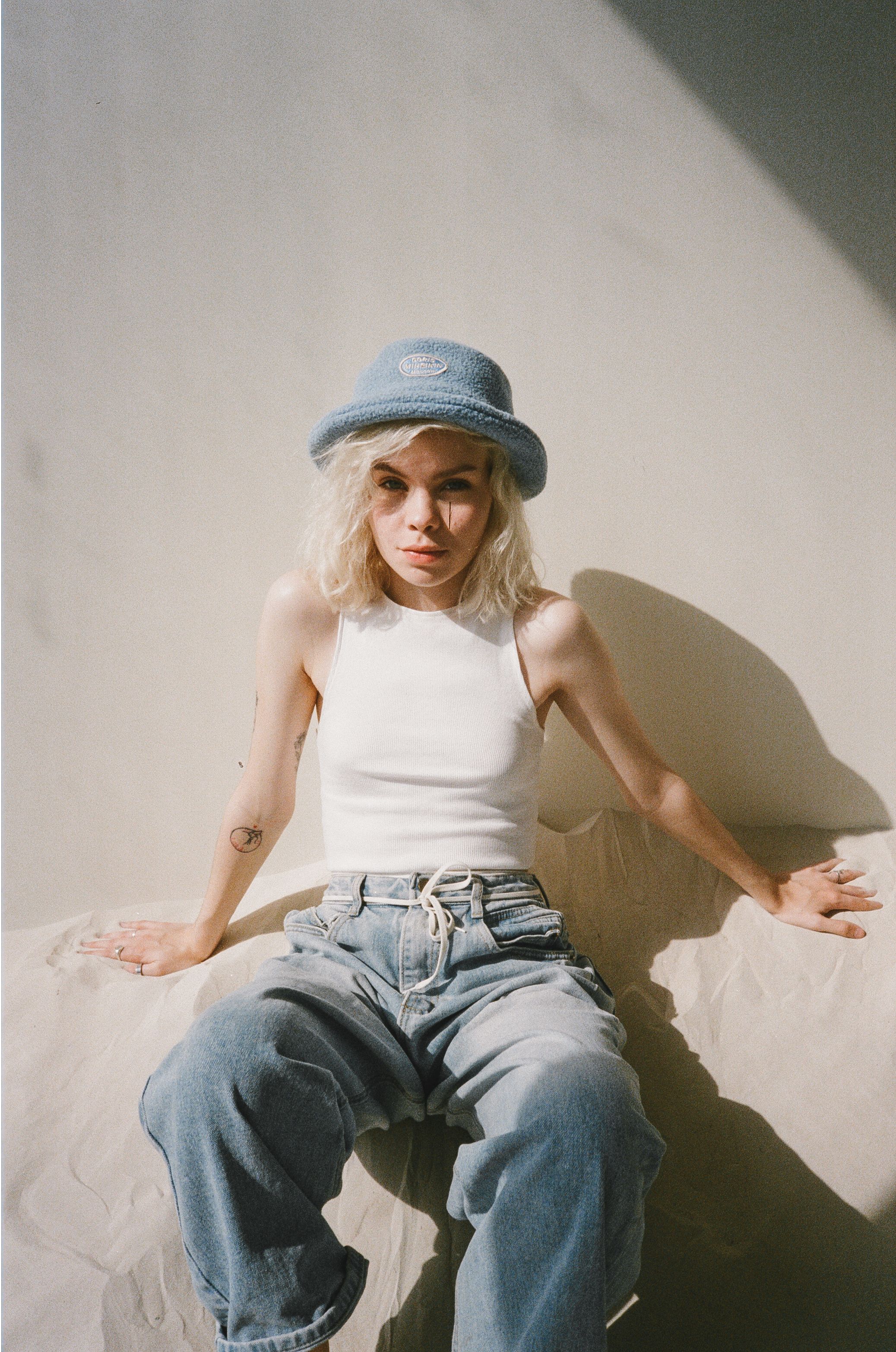 Woman in White Top and Blue Denim Jeans · Free Stock Photo