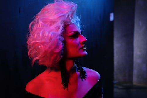 Drag Queen in Dim Red and Blue Light