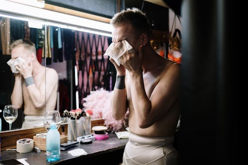 Topless Man Removing Makeup