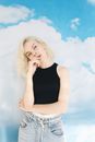 Woman in Black Tank Top and White Denim Shorts