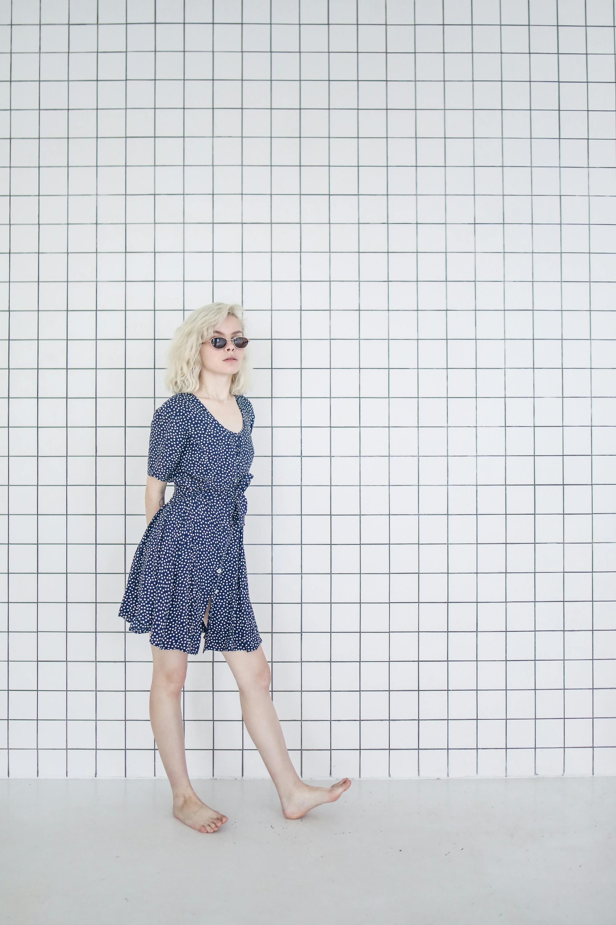 girl in blue and white polka dot dress